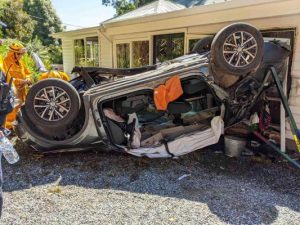 Vehicle flips, lands in house