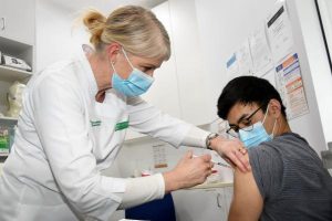 System overrun as Victorians rush to book Pfizer