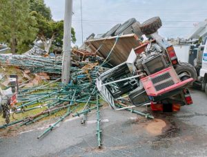 Truck carrying scaffolding flips on Glenfern Road