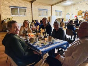 Monthly community dinners begin with a warm reception from Hills locals