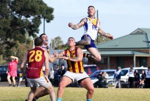 Hawks win in war of attrition