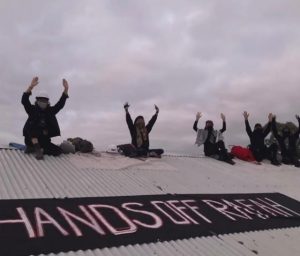 Charges laid after rooftop protest