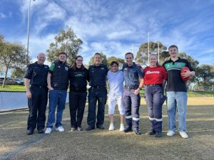 Local footy fan reunites with heroes who saved his life