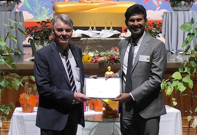 Frank Carter honoured for Buddhist education work